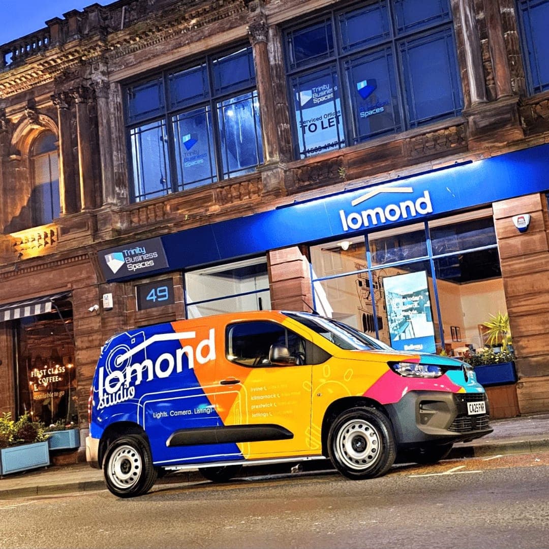 A Lomond Studio branded van parked outside one of Lomond Property's Ayrshire offices at dusk