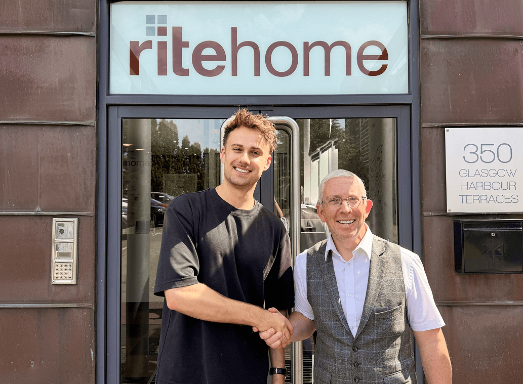Robert Nixton, Managing Director of Ritehome, shaking hands with a Wooma team member outside the Ritehome office